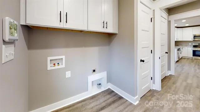 a view of cabinets and wooden floor