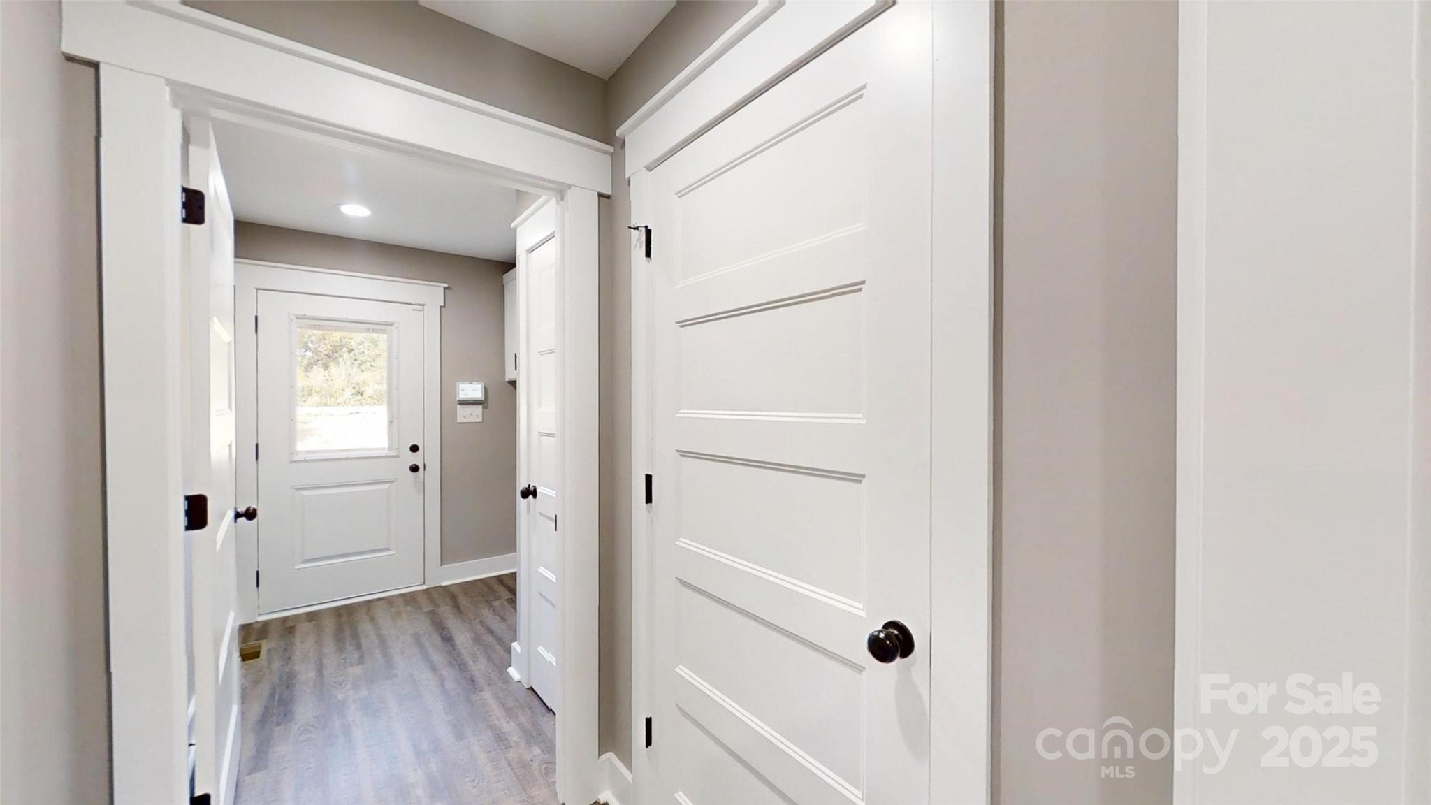 268 Vic Randall Road Lawndale, NC 28090 - Photo 18 of 22 a view of a hallway with wooden floor