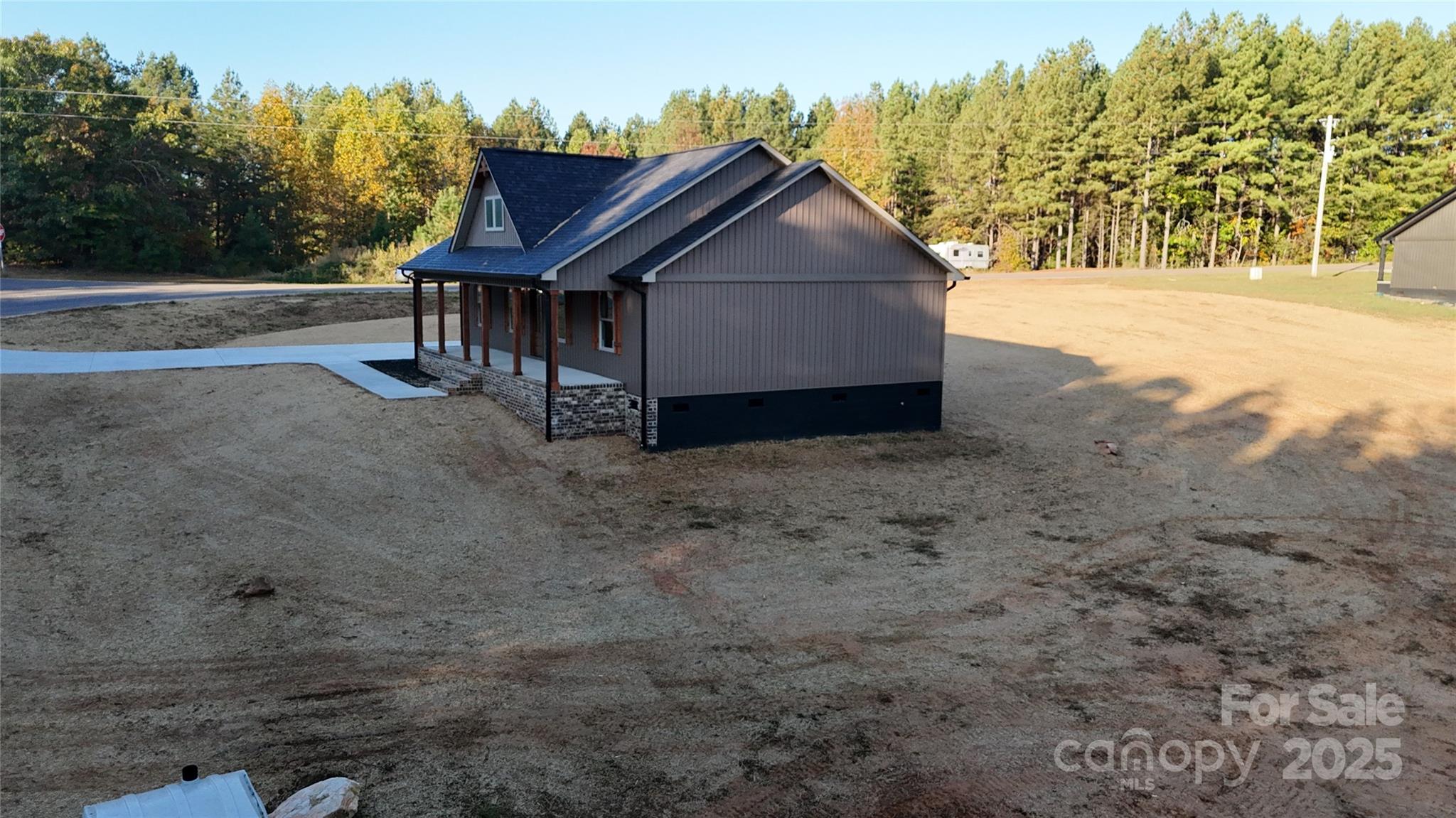 268 Vic Randall Road Lawndale, NC 28090 - Photo 21 of 22 a view of a house with a yard