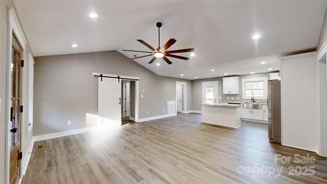 a view of kitchen with cabinets and wooden floor