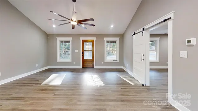 a view of livingroom with hardwood floor and ceiling fan