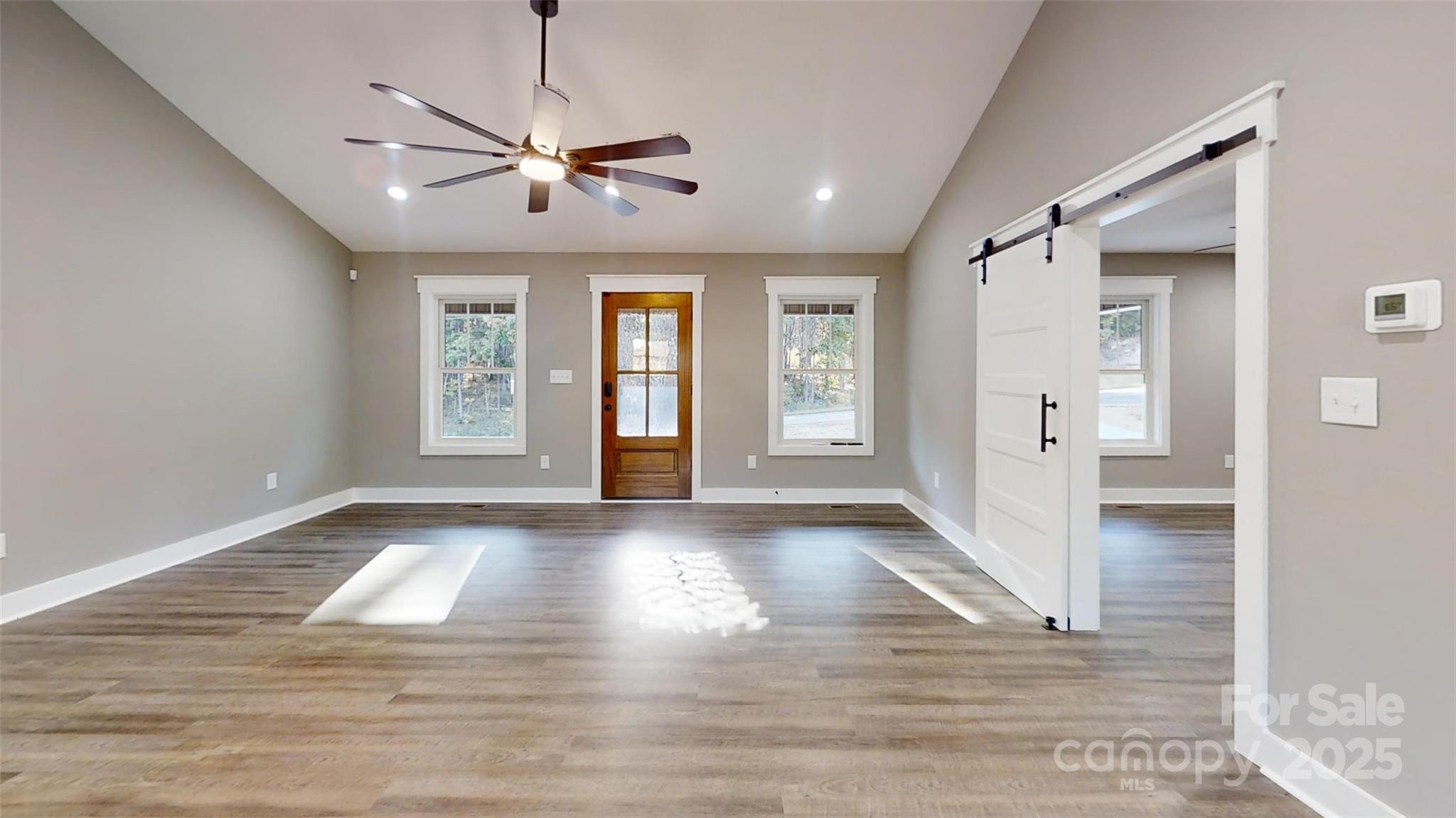 268 Vic Randall Road Lawndale, NC 28090 - Photo 4 of 22 a view of livingroom with hardwood floor and ceiling fan