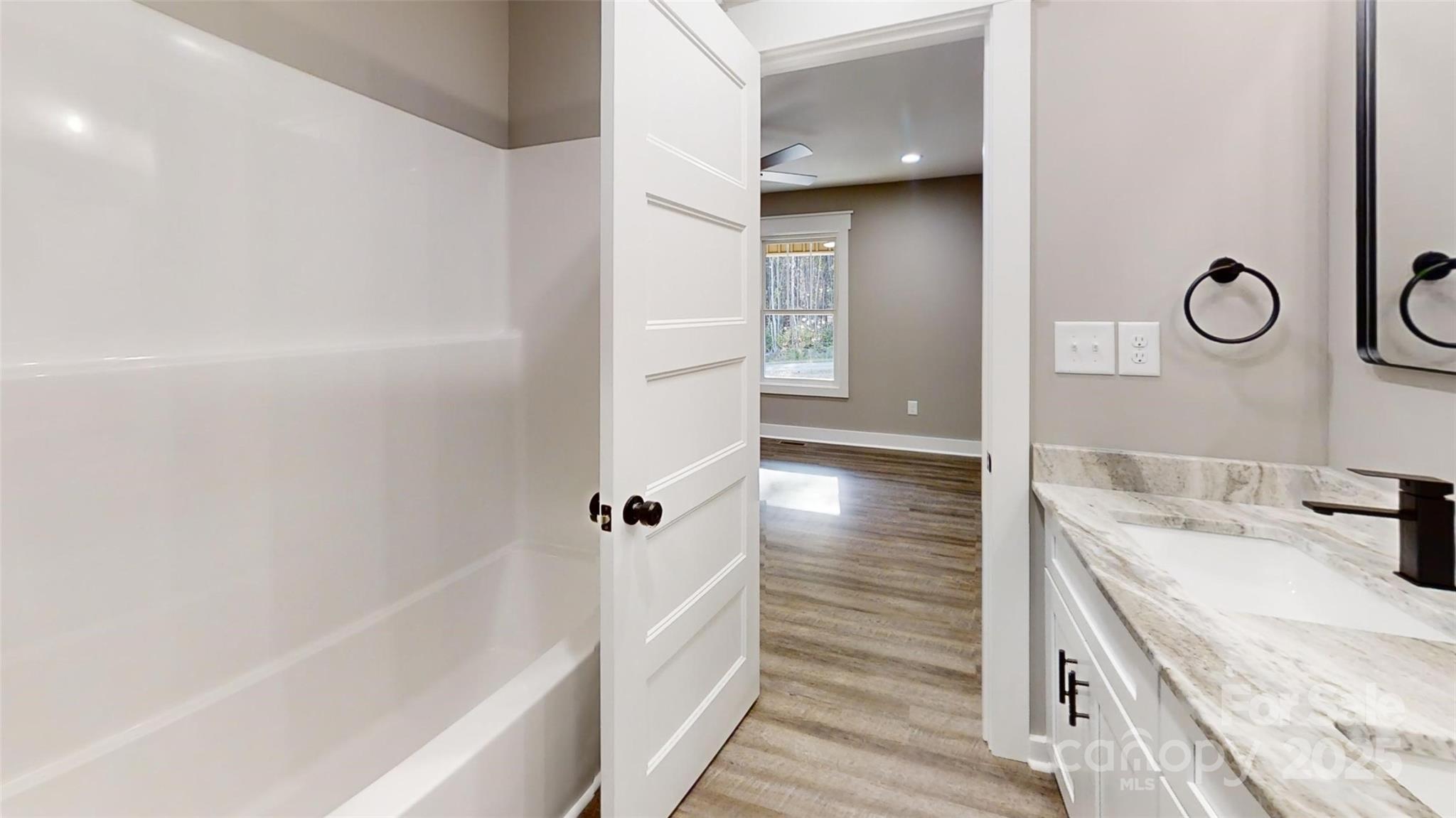 268 Vic Randall Road Lawndale, NC 28090 - Photo 5 of 22 a bathroom with a bathtub and a sink