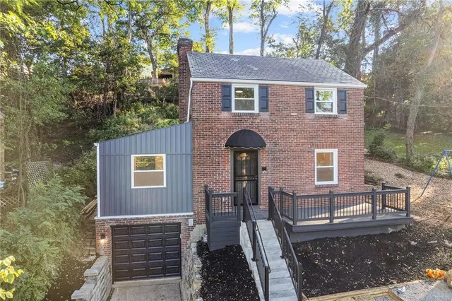 a front view of a house with yard