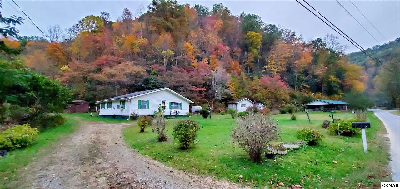 2485 Happy Hollow Road Sevierville, TN 37862 - Photo 1 of 35 an aerial view of a house with a big yard and large trees