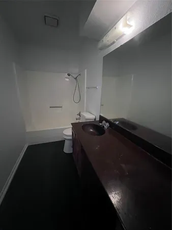 a bathroom with a sink and vanity