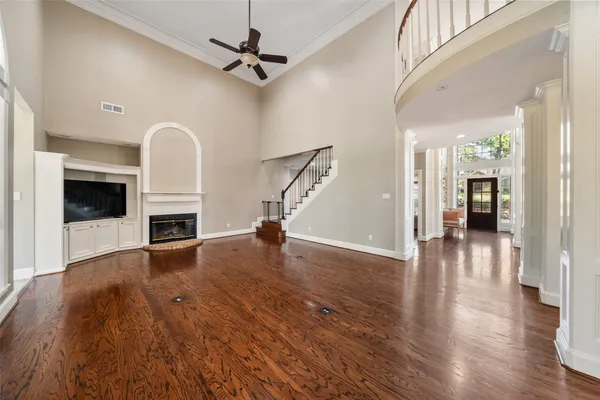 a living room with furniture and a dining table