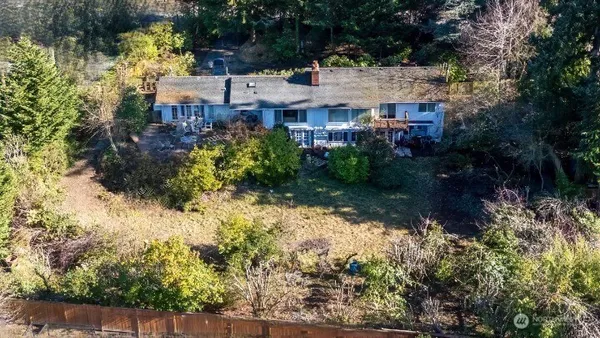 a view of a house with a yard and garden