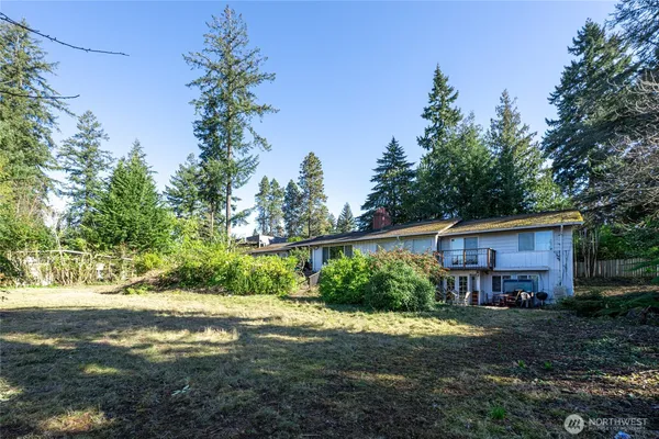 a view of a house with yard and a garden