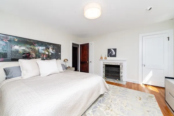 a large white bed in a white room