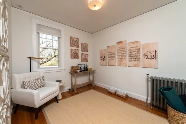 a bedroom with furniture and a window