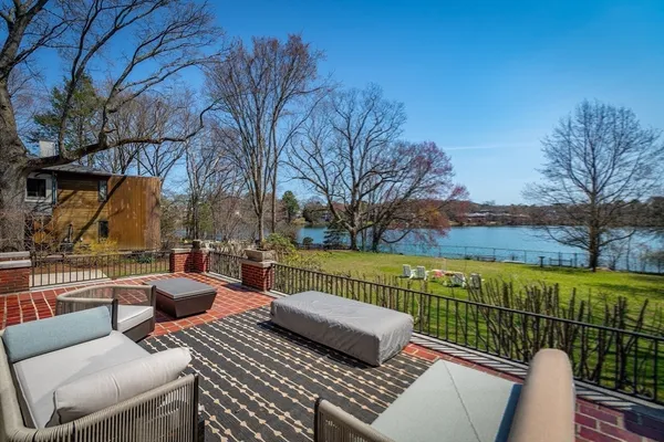 a view of a patio with couches chairs and a potted plant