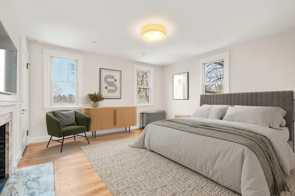a bedroom with a bed and a couch