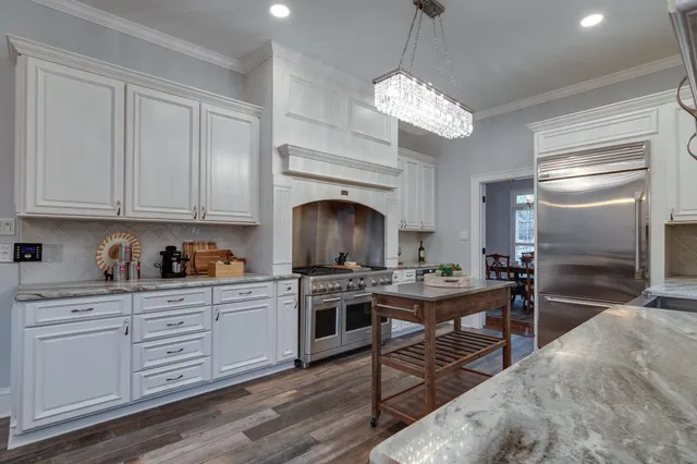 a kitchen with a stove oven and cabinets