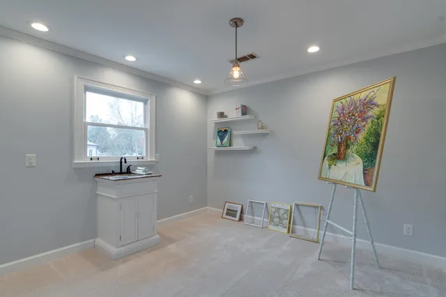a spacious bathroom with a shower sink mirror and toilet