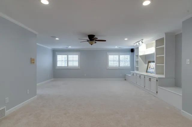 a bathroom with granite countertop a sink and a mirror