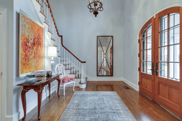 a view of an entryway with wooden floor