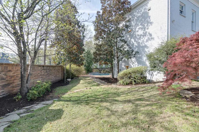 a view of a backyard with furniture