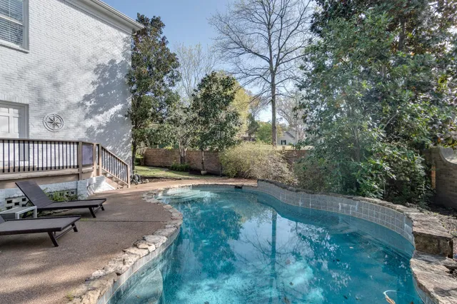 a view of backyard and deck