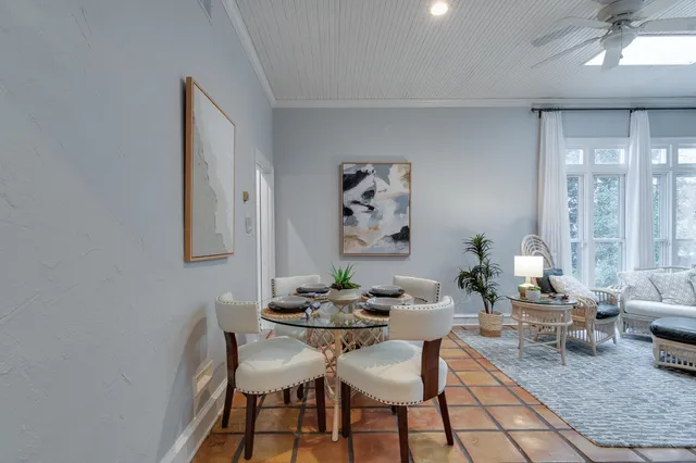 a dining room with furniture and window