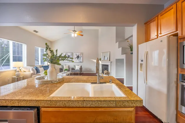 a spacious bathroom with a tub sink and mirror