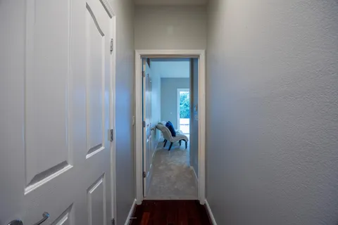 a spacious bathroom with a tub sink and mirror