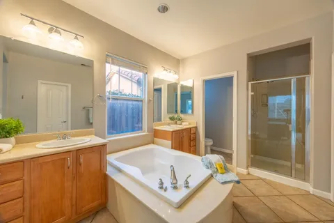 an empty room with a ceiling fan and a window