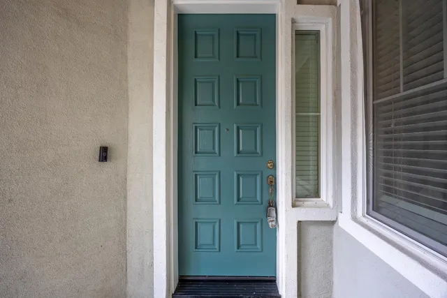a view of a dining room with furniture wooden floor and a potted plant