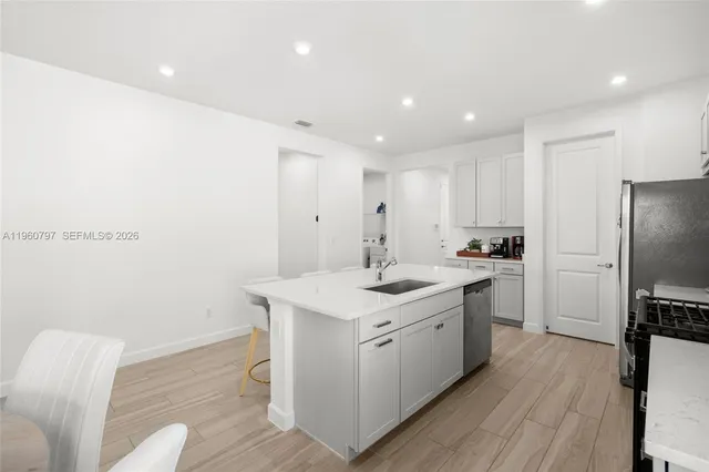 a spacious bedroom with a bed and a large window