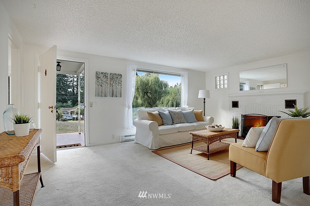 8729 236th Street Southwest Edmonds, WA 98026 - Photo 3 of 15 a living room with furniture and a window