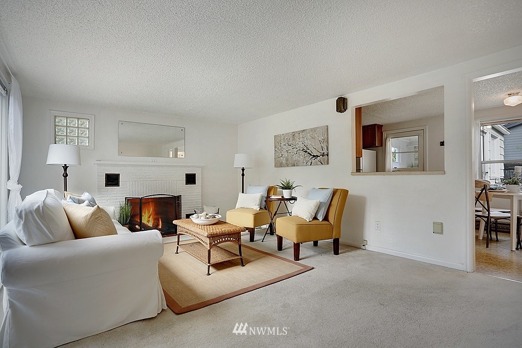 8729 236th Street Southwest Edmonds, WA 98026 - Photo 5 of 15 a living room with furniture and a fireplace