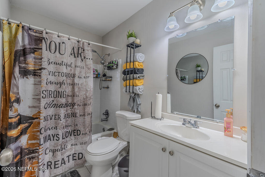 7580 Strato Road Jacksonville, FL 32210 - Photo 12 of 27 a bathroom with a sink a toilet and shower