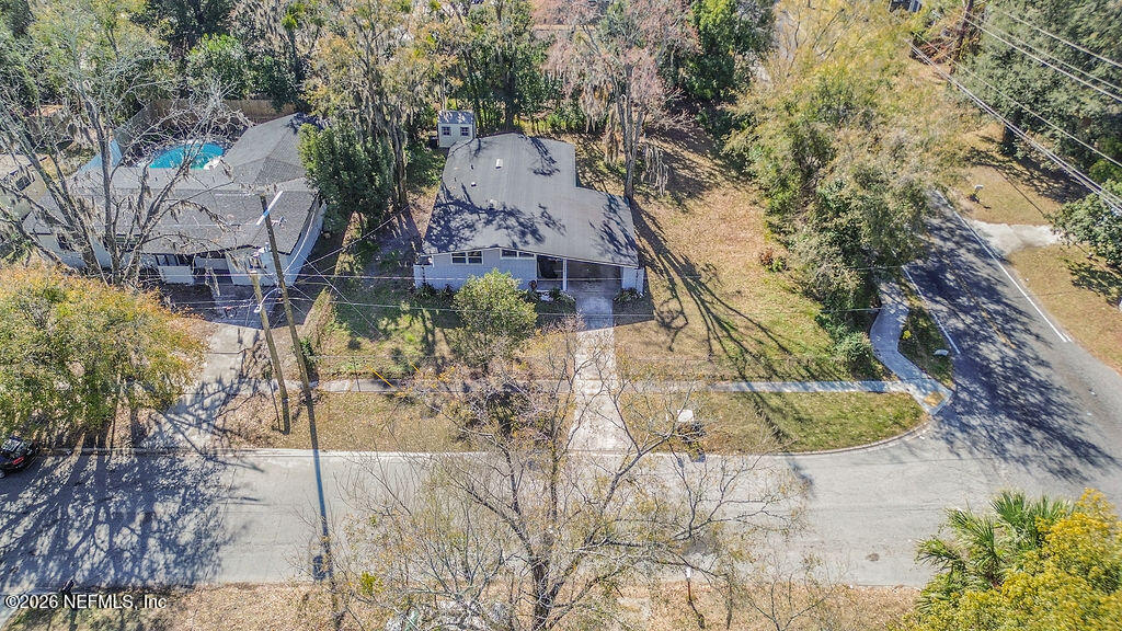 7580 Strato Road Jacksonville, FL 32210 - Photo 24 of 27 a aerial view of a house with a yard and large trees