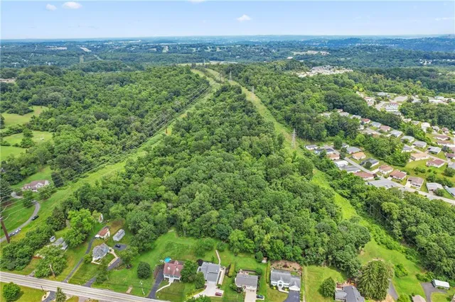 a view of a yard with an outdoor seating