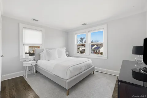 a bed room with a bed and a window