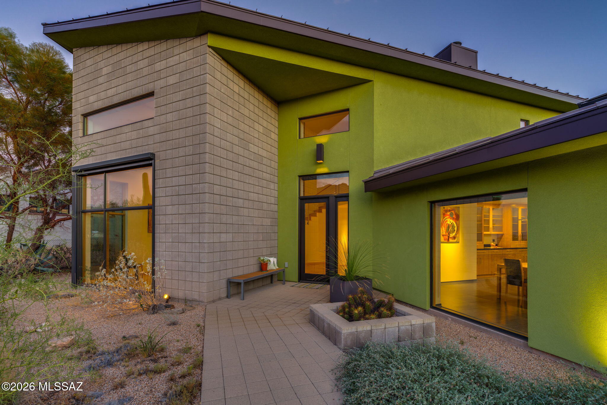 5070 North Valley View Road Tucson, AZ 85718 - Photo 8 of 51 a front view of a house with garden