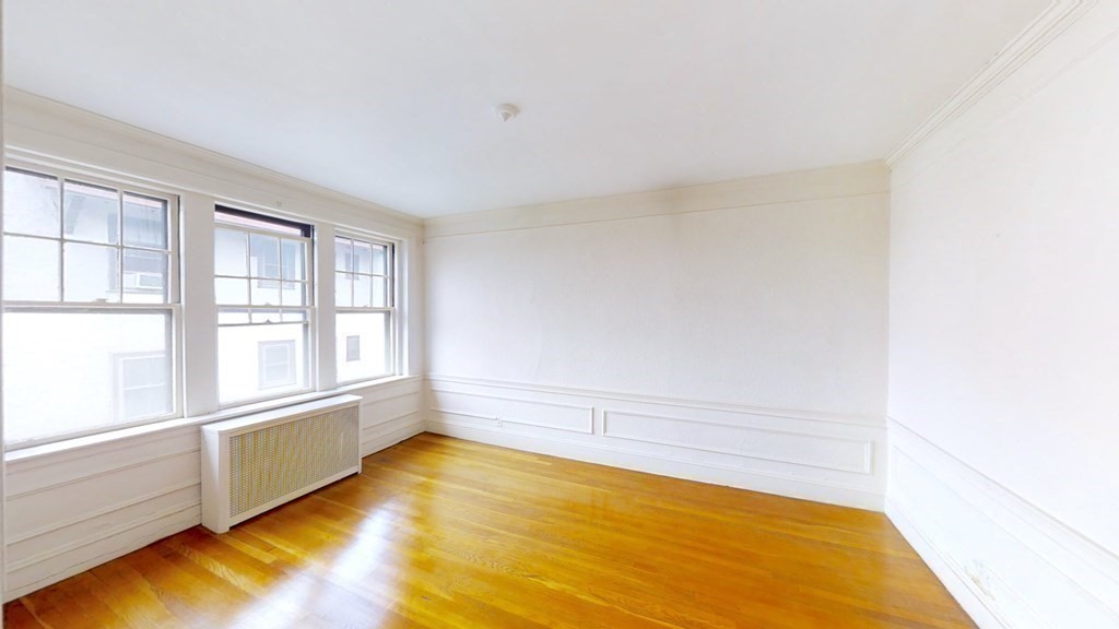 321 Tappan Street, Unit 6 Brookline, MA 02445 - Photo 3 of 14 a view of an empty room with a window