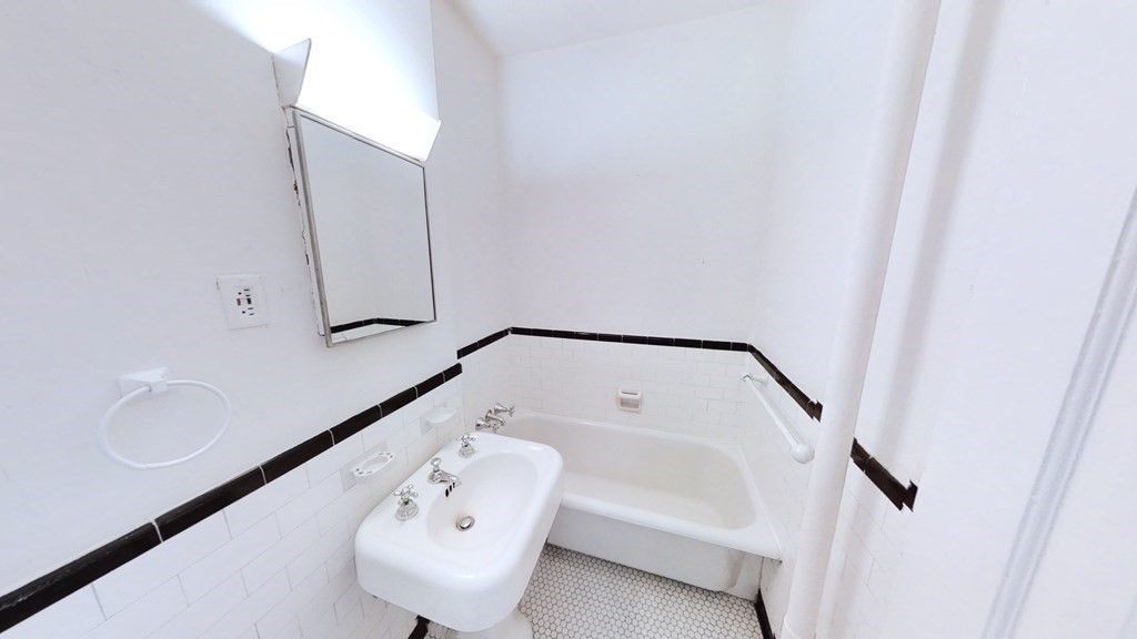 321 Tappan Street, Unit 6 Brookline, MA 02445 - Photo 10 of 14 a bathroom with a bathtub and shower
