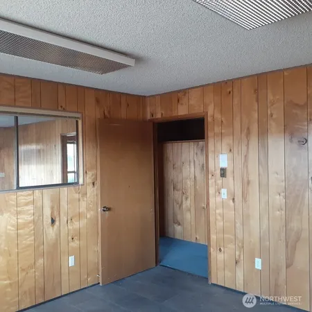 a view of a room with wooden walls