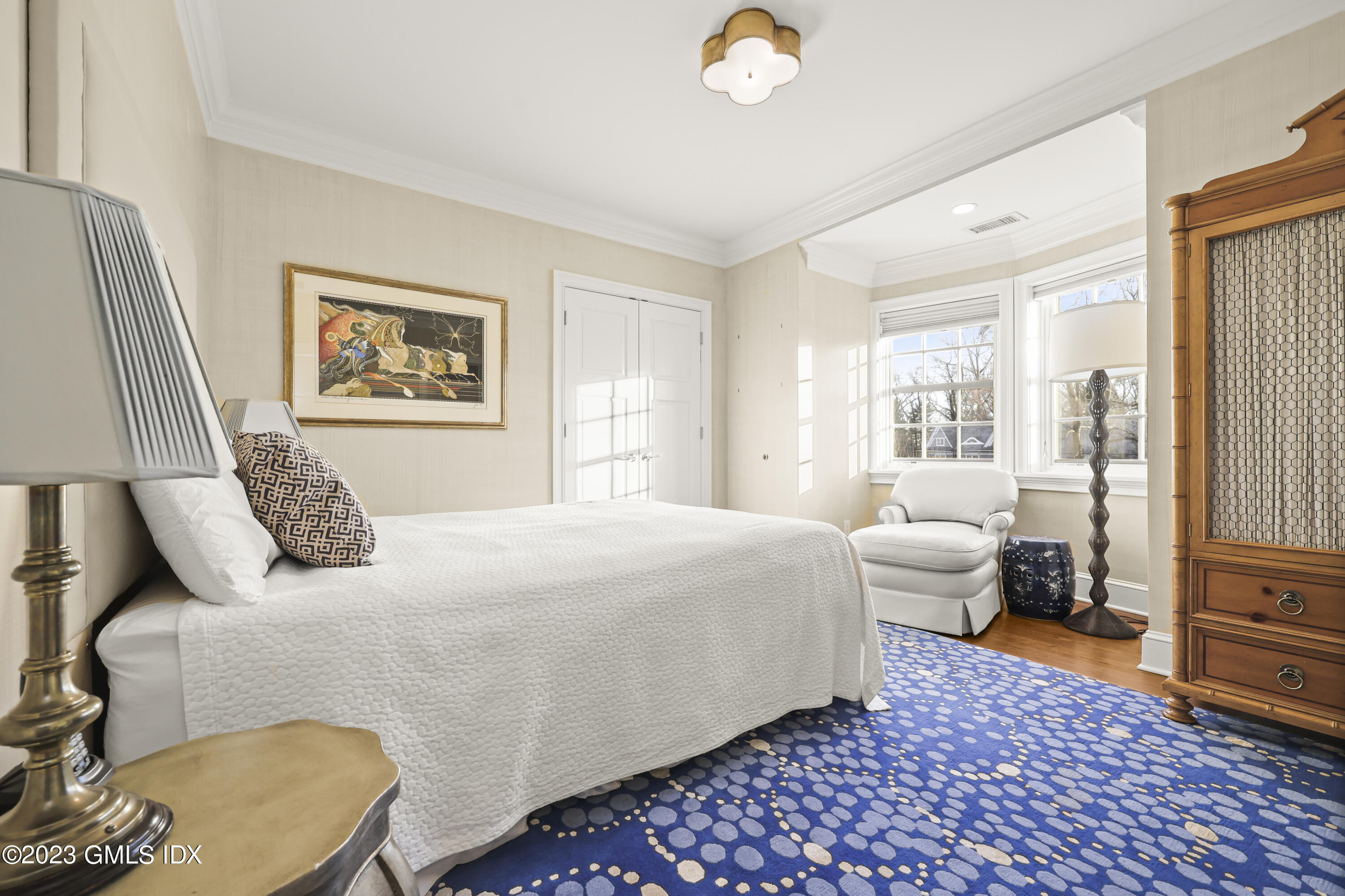 86 Winthrop Drive Riverside, CT 06878 - Photo 15 of 26 a bedroom with a bed and wooden floor