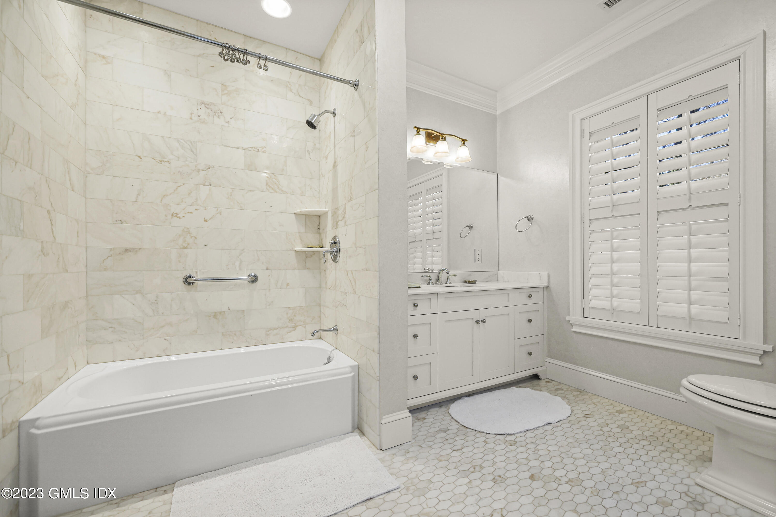 86 Winthrop Drive Riverside, CT 06878 - Photo 17 of 26 a bathroom with a granite countertop sink a toilet and shower