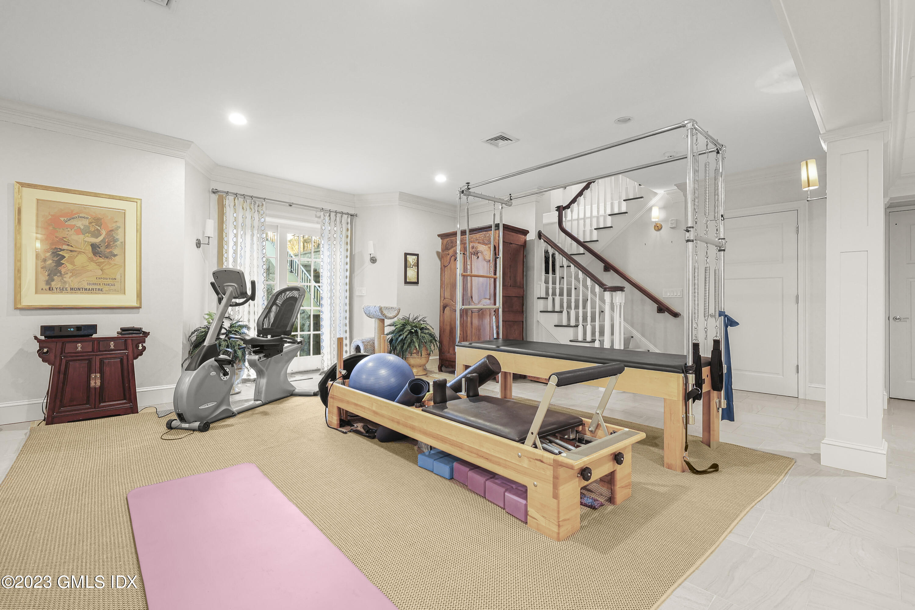 86 Winthrop Drive Riverside, CT 06878 - Photo 19 of 26 a living room with furniture gym equipment and a wooden floor