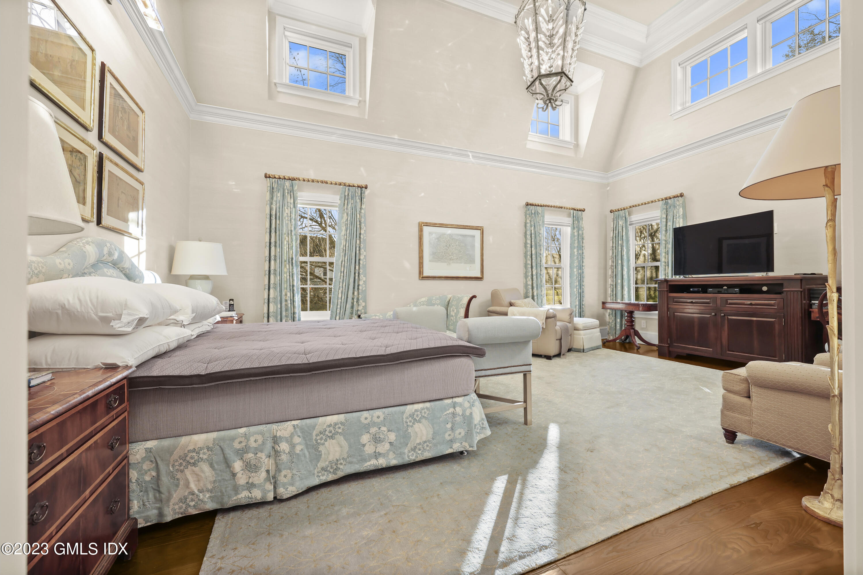 86 Winthrop Drive Riverside, CT 06878 - Photo 5 of 26 a bedroom with a bed couch tv and window