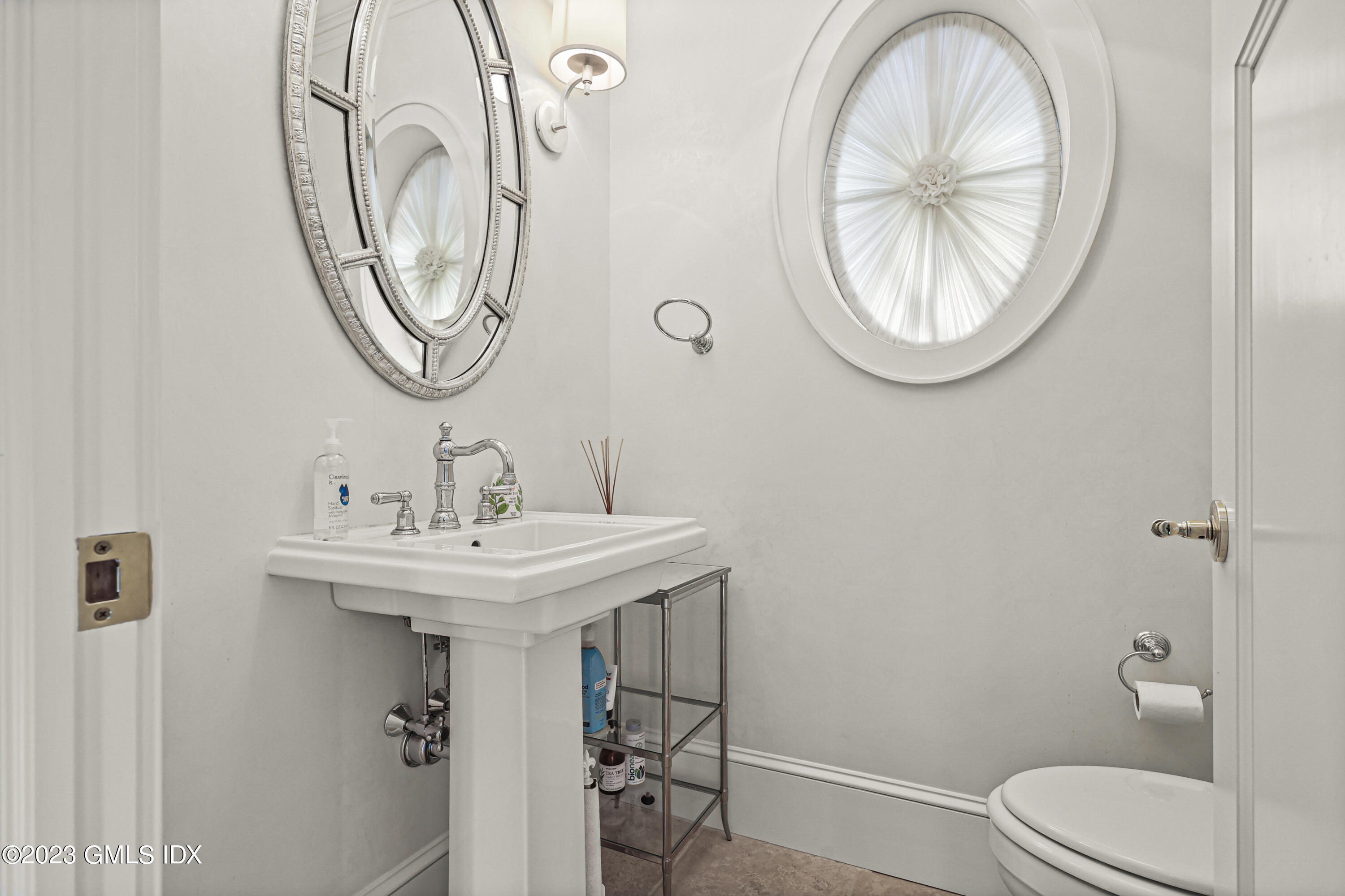 86 Winthrop Drive Riverside, CT 06878 - Photo 7 of 26 a bathroom with a toilet a sink and a mirror