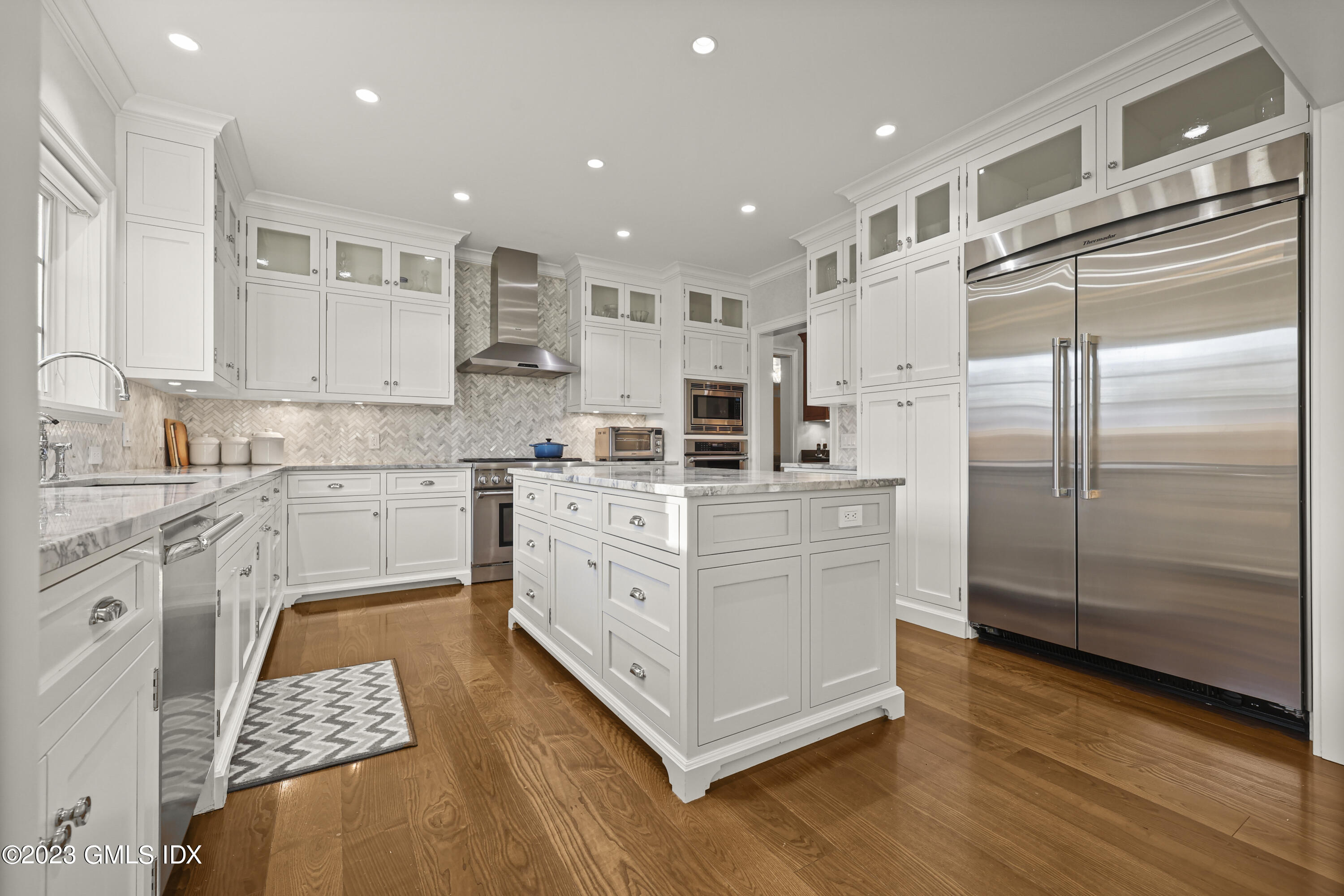 86 Winthrop Drive Riverside, CT 06878 - Photo 8 of 26 a kitchen with stainless steel appliances granite countertop a refrigerator and a stove top oven