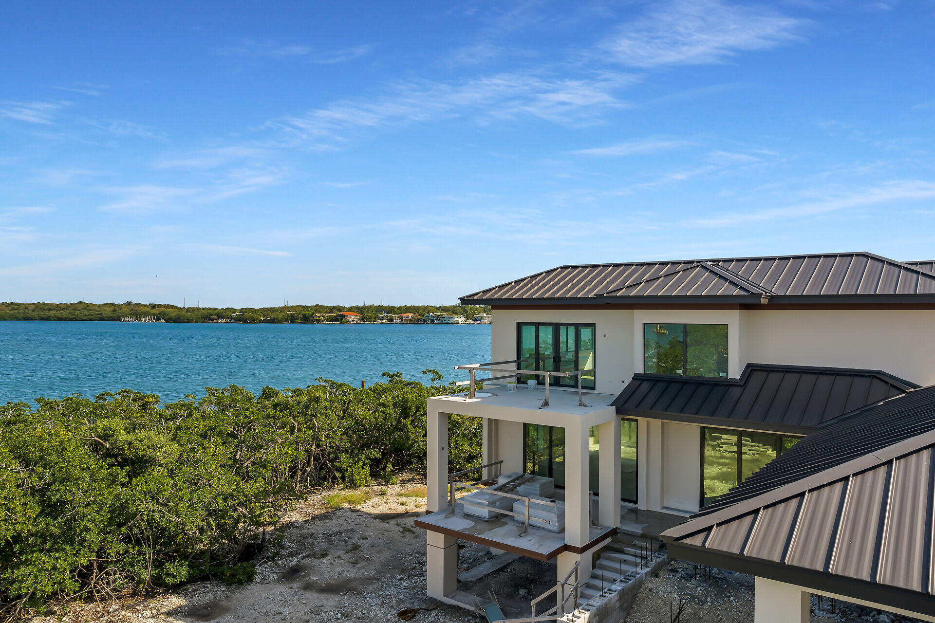 25 Mutiny Place Key Largo, FL 33037 - Photo 11 of 41 a front view of a house with a lake view