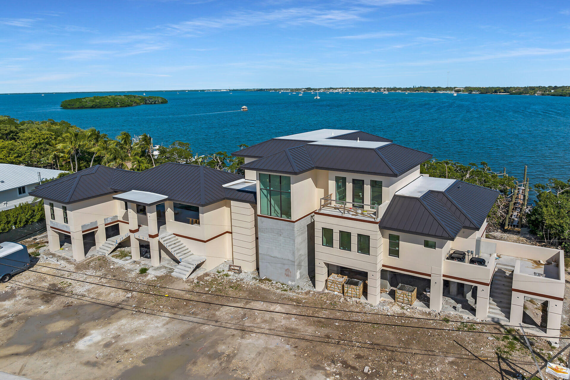 25 Mutiny Place Key Largo, FL 33037 - Photo 3 of 41 an aerial view of multiple houses with a lake view