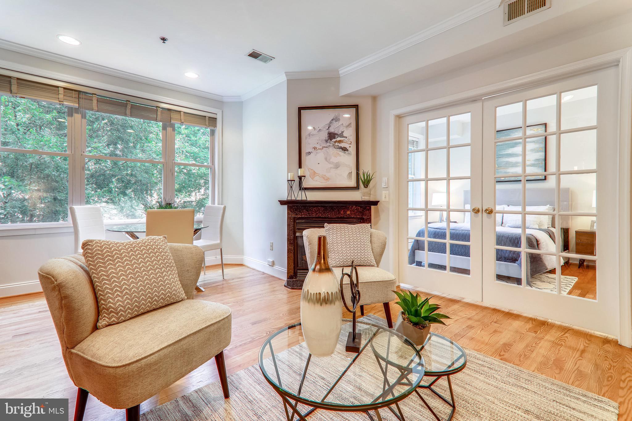 1438 Columbia Road Northwest, Unit 201 Washington, DC 20009 - Photo 11 of 27 Living room/dining area/fireplace/french doors