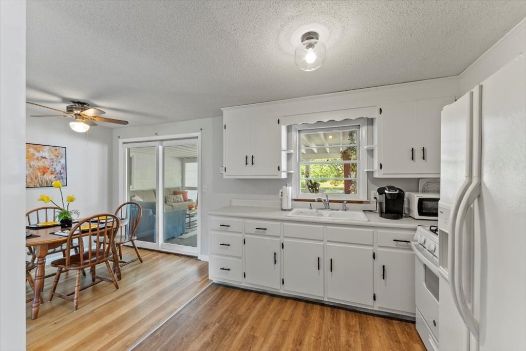 528 Morgan Road West Springfield, MA 01089 - Photo 14 of 42 a kitchen with stainless steel appliances a white stove top oven cabinets and a refrigerator