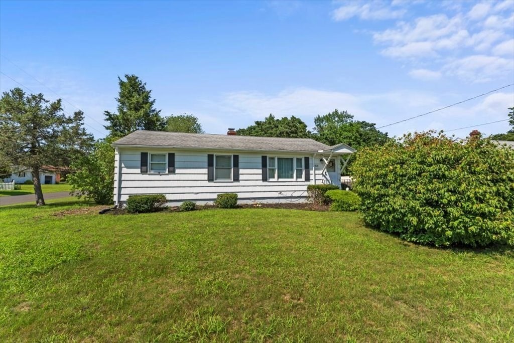 528 Morgan Road West Springfield, MA 01089 - Photo 5 of 42 a front view of a house with a garden